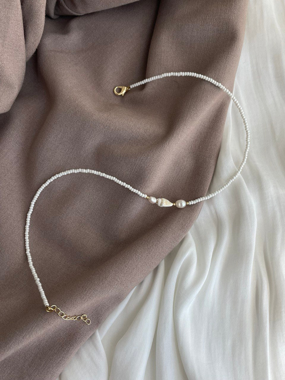 Necklace with pearls and shells