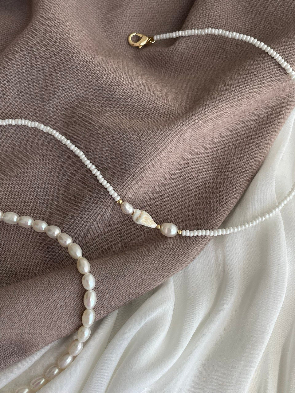 Necklace with pearls and shells