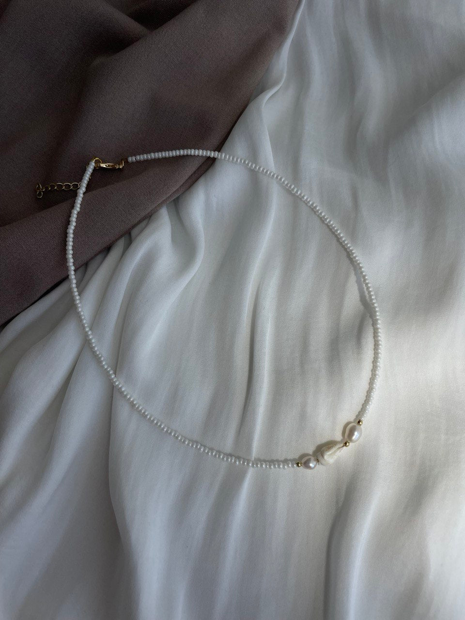 Necklace with pearls and shells