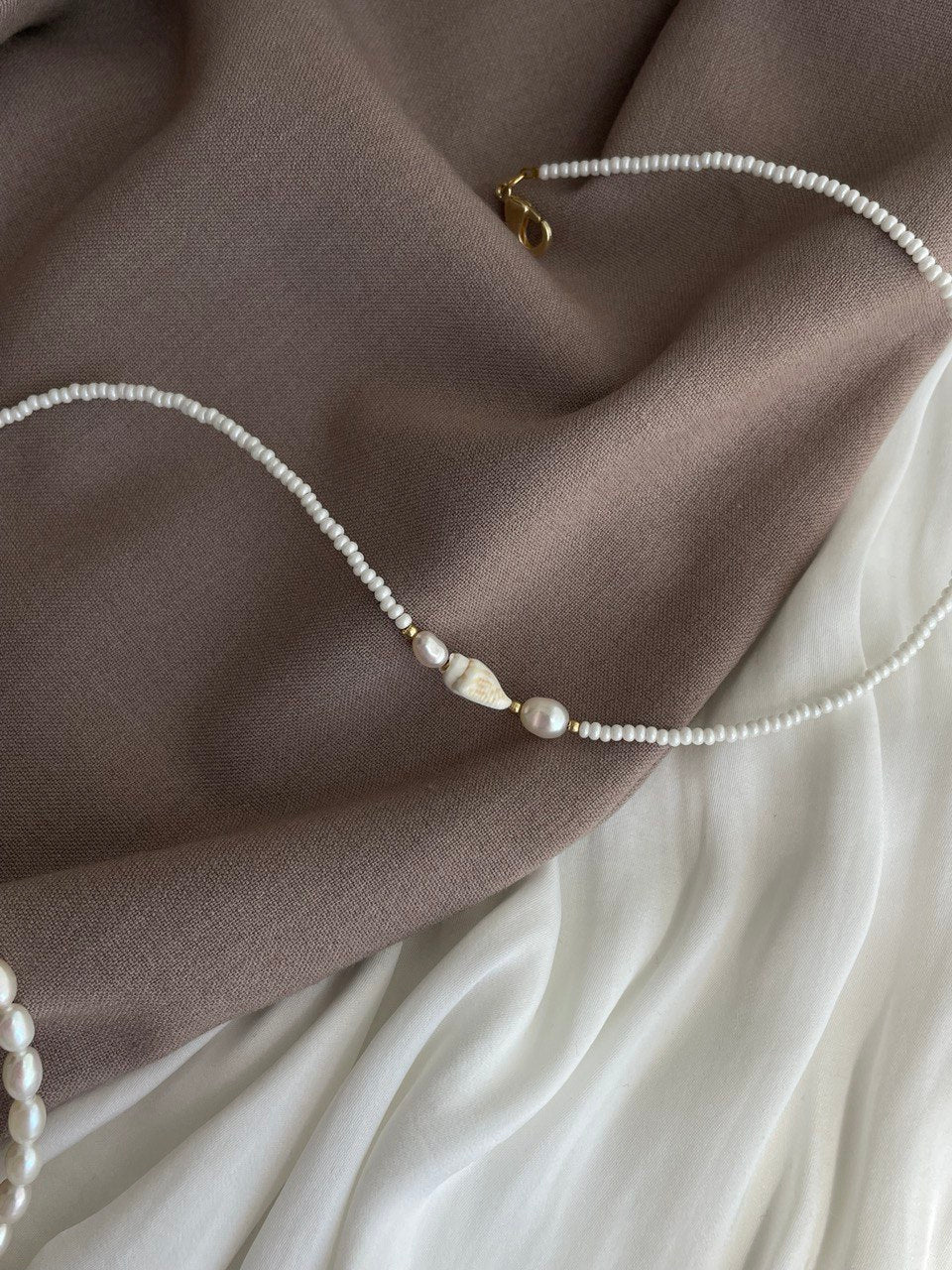 Necklace with pearls and shells