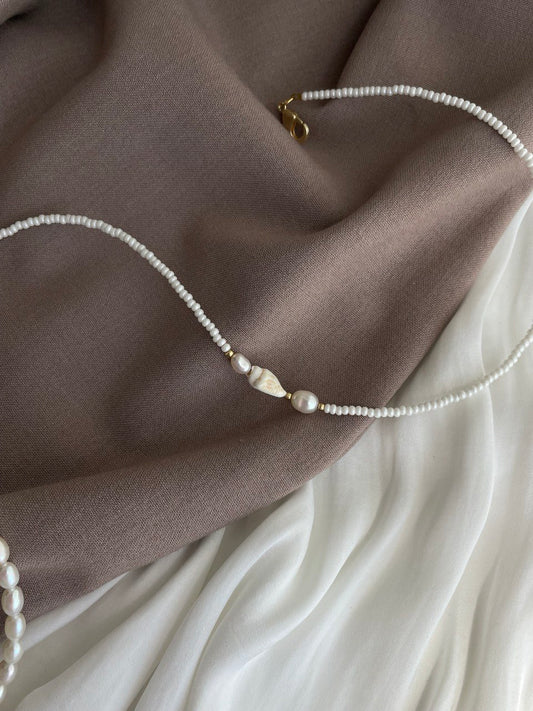 Necklace with pearls and shells